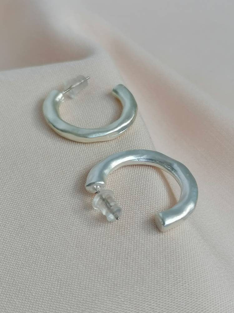 Matt hammered small hoops in silver