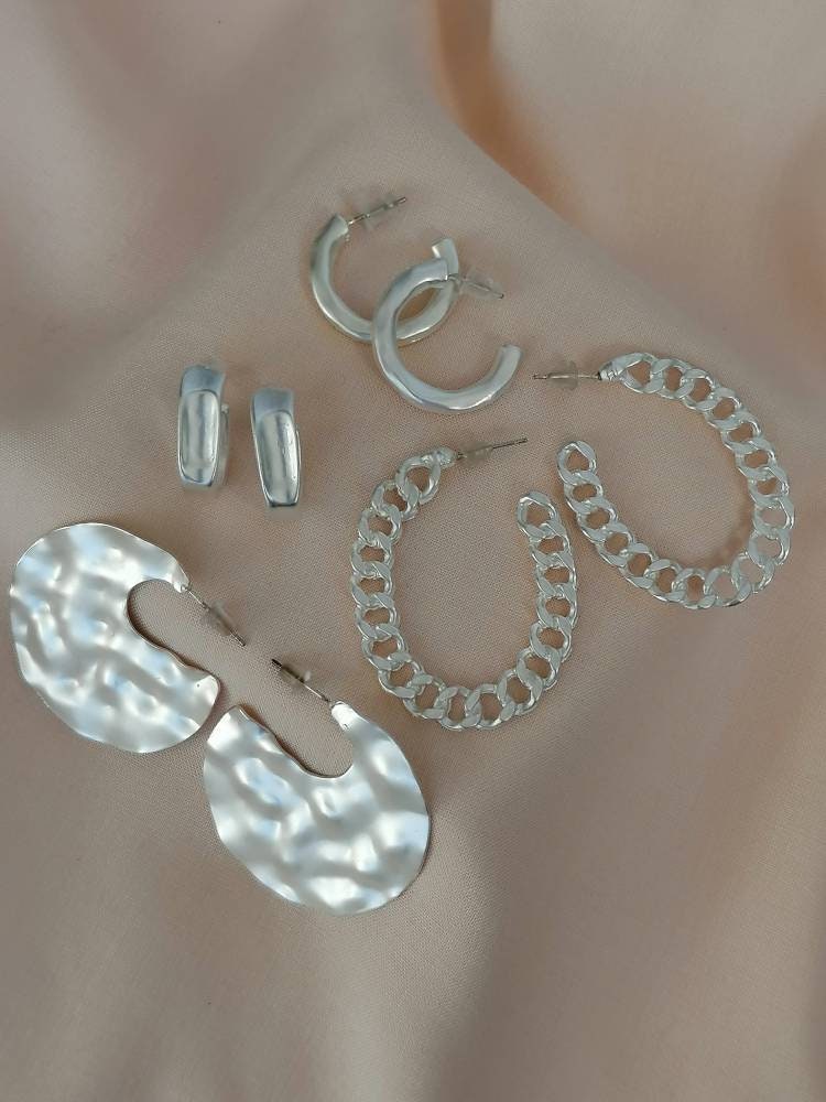 Matt hammered small hoops in silver