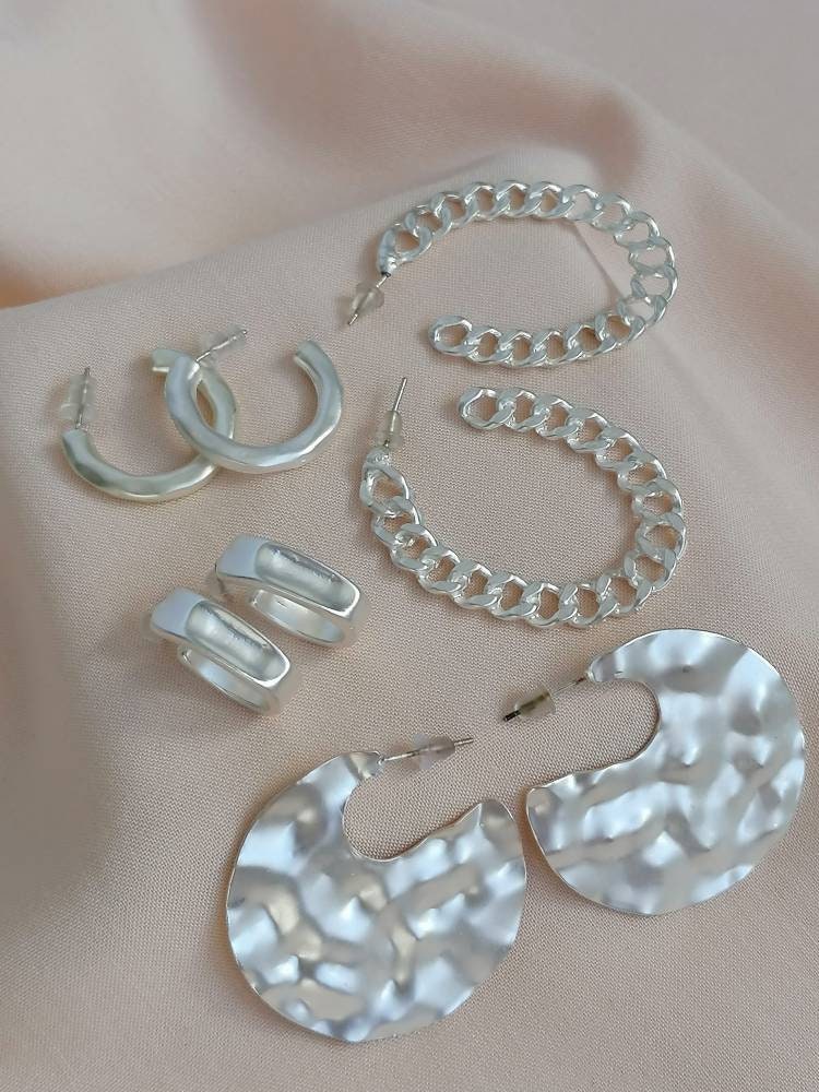 Matt hammered small hoops in silver