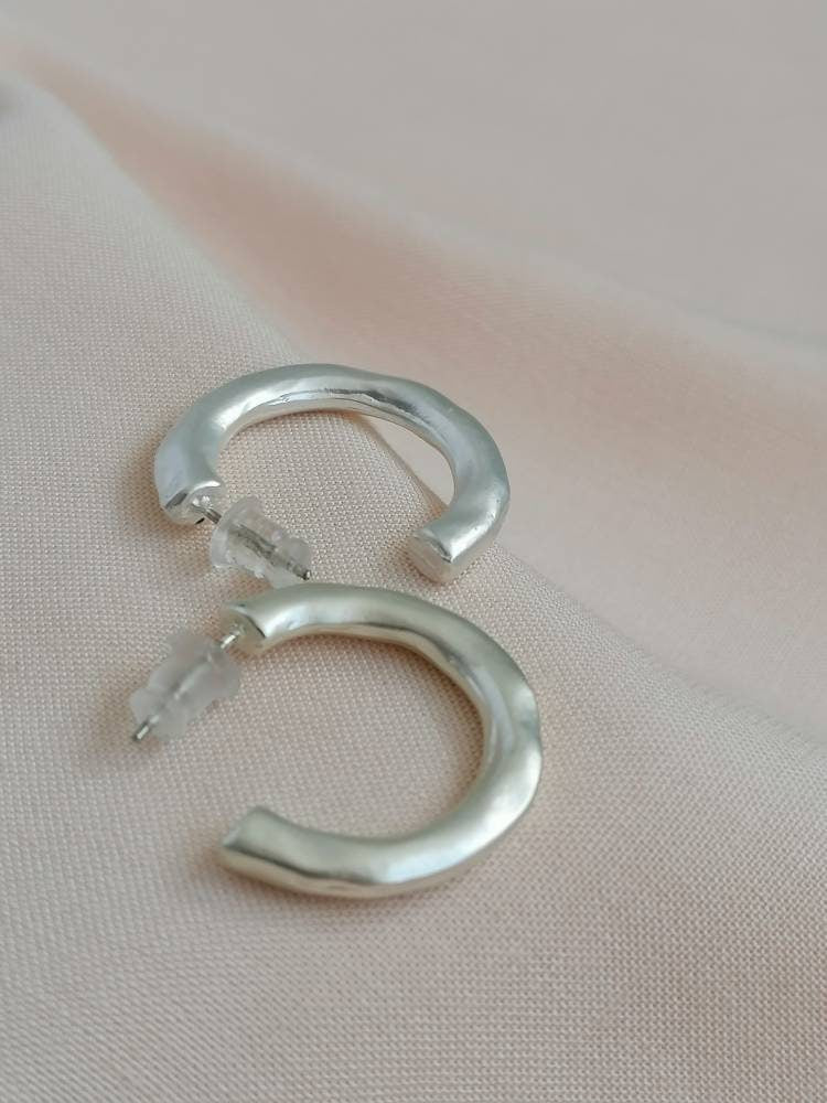 Matt hammered small hoops in silver